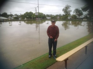 Paul Reynolds stands beside the the bowling green at North Ipswich Bowls Club. Swimming not Gateball is the only thing on offer.